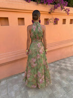 Florencia — Vestido largo verde con estampado floral y cuello halter